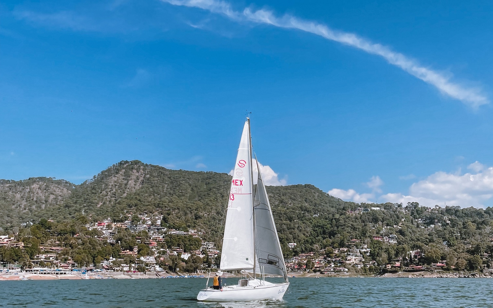 'Image of our resort's wind sailing boat with our island at the back